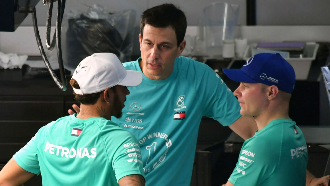 Mercedes boss Toto Wolff speaks with drivers Lewis Hamilton and Valtteri Bottas