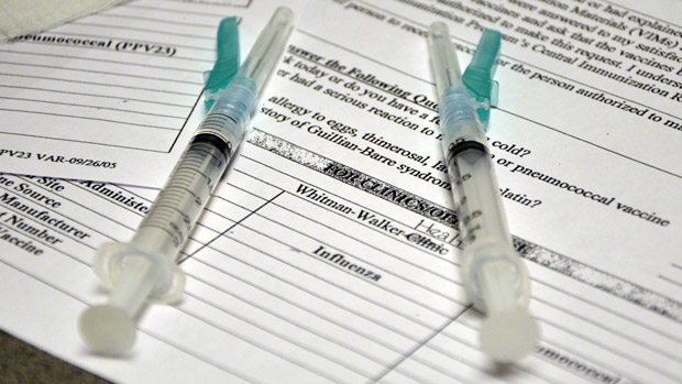 Two syringes containing flu vaccine