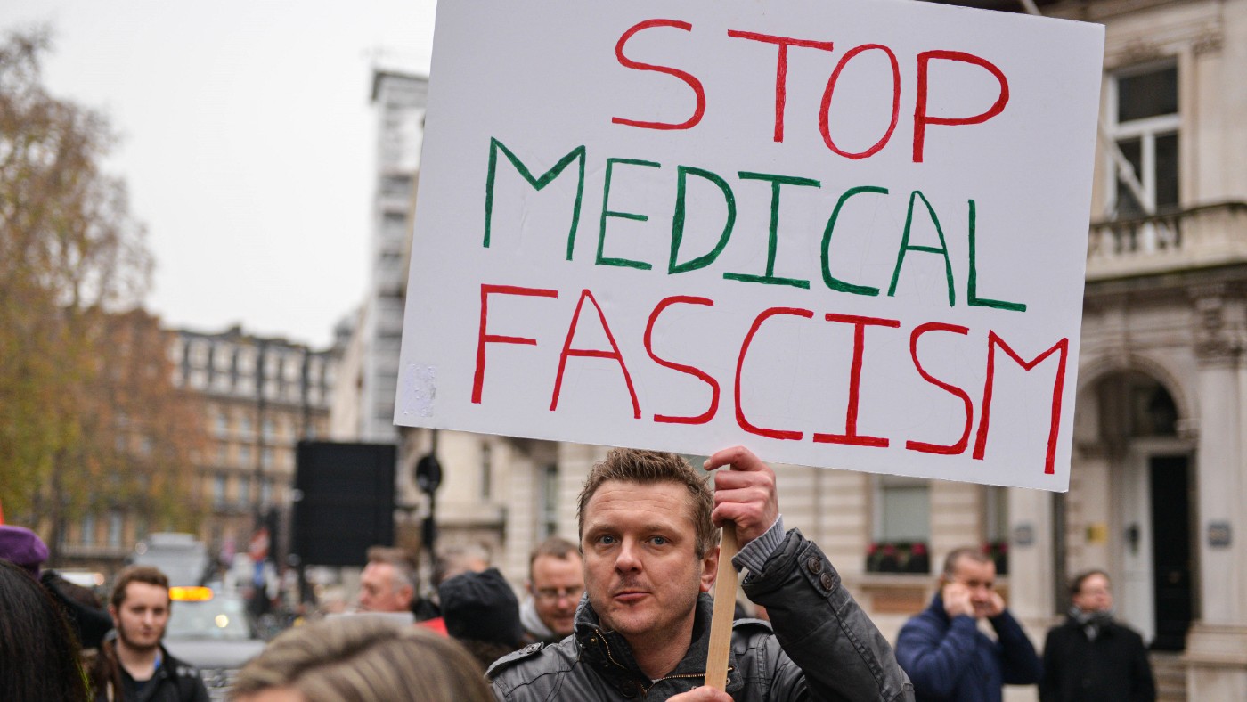 Protester with 'stop medical fascism' sign