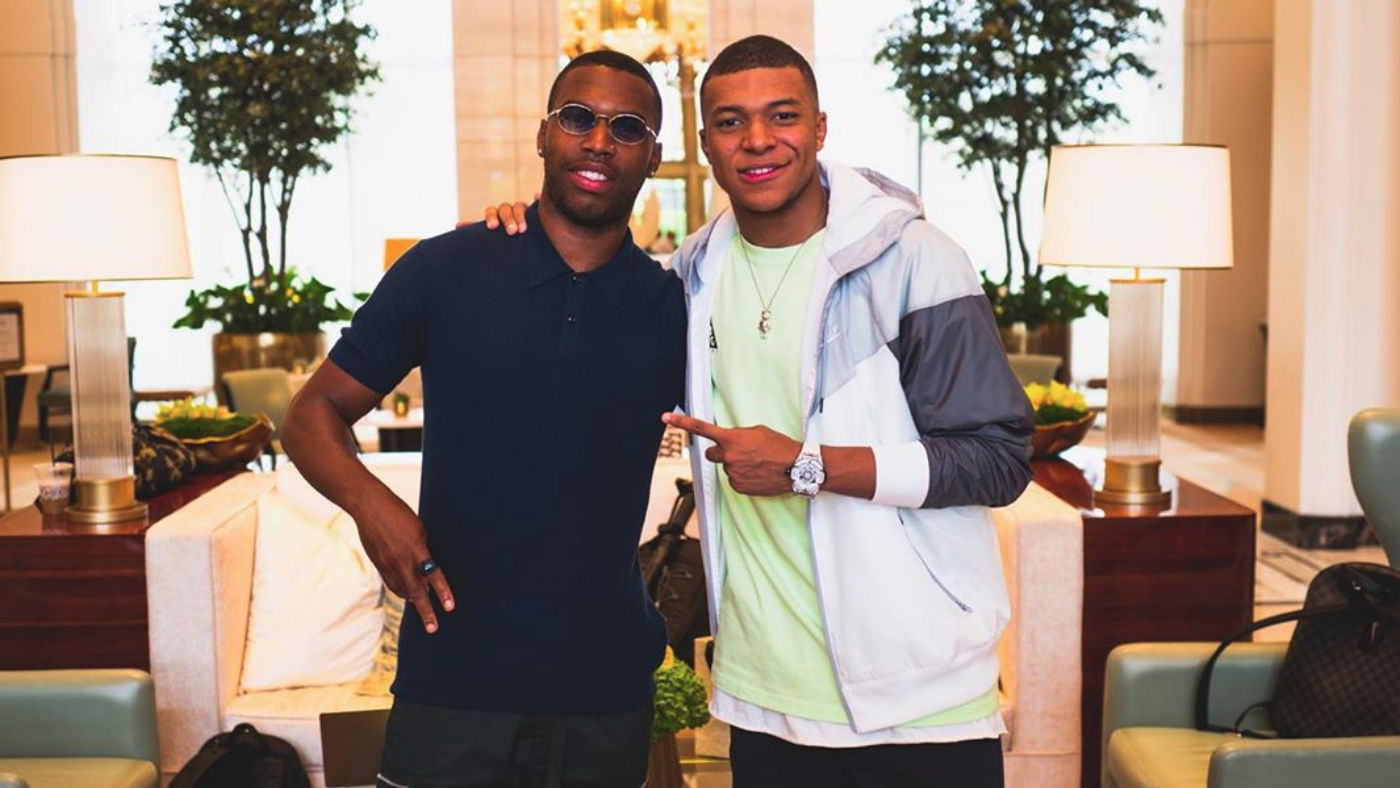 Former Liverpool striker Daniel Sturridge poses for a picture with French star Kylian Mbappe