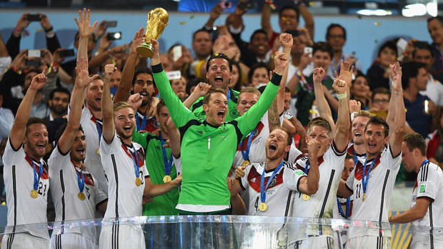 The German squad hoists the World Cup