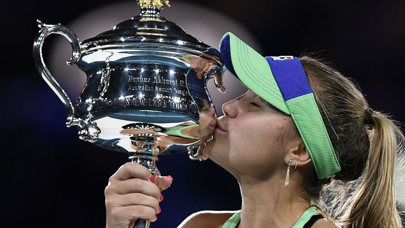 Sofia Kenin kisses the Daphne Akhurst Memorial Cup after winning the Australian Open 