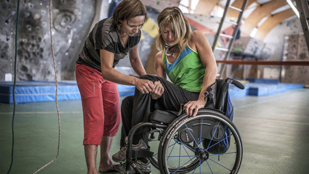 A paraplegic woman get assistance 