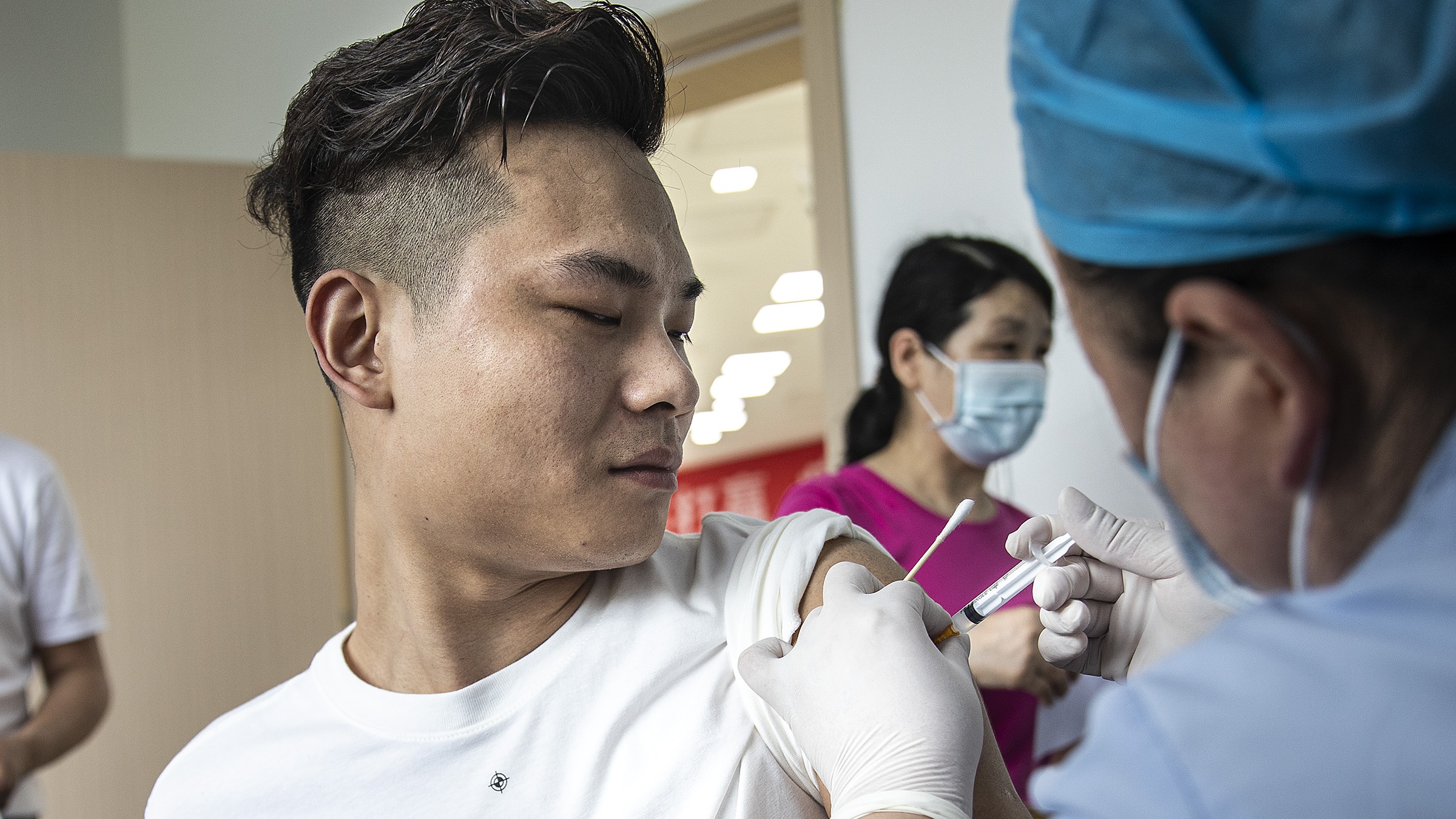 A man receives a Covid-19 vaccine in Wuhan, Hubei province