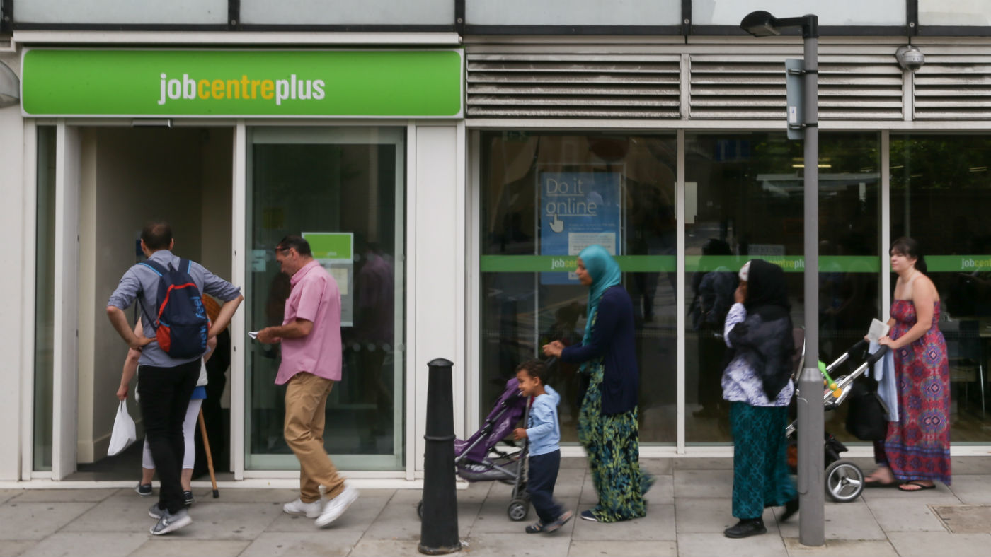 People queuing outside a Job Centre in east London