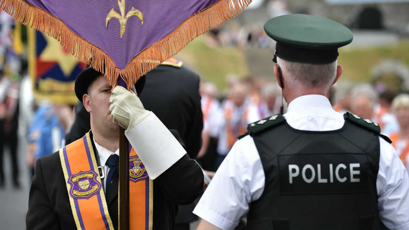Orangemen are stopped by a PSNI officer during a parade in Portadown this week