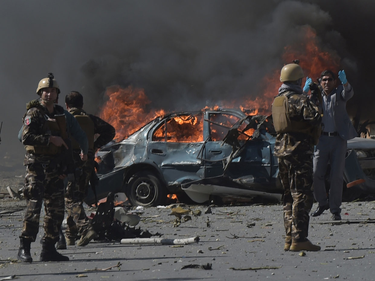 Afghan security forces personnel are seen at the site of a car bomb attack in Kabul on May 31, 2017.At least 40 people were killed or wounded on May 31 as a massive blast ripped through Kabul