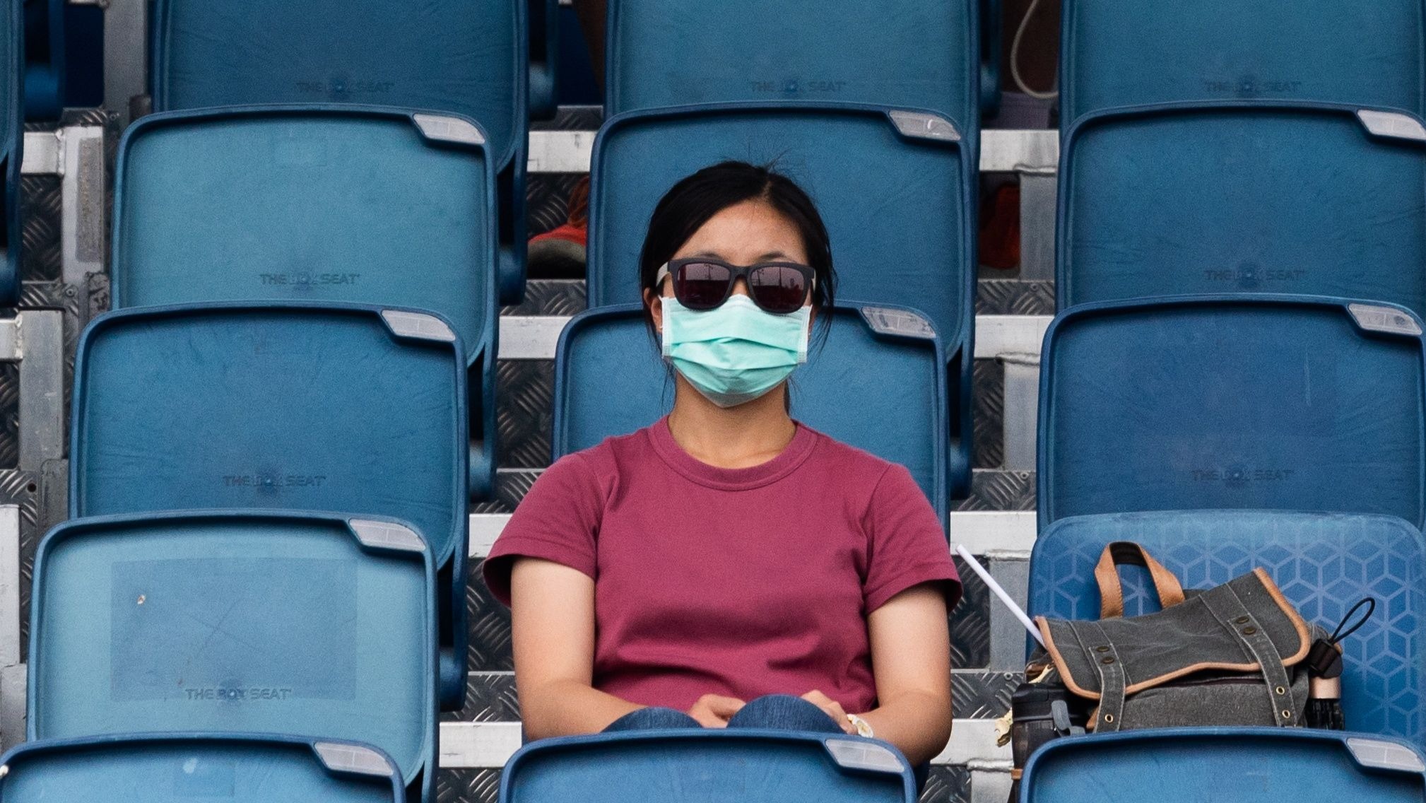 A spectator at the Australian Open, which has been affected by smoke from bushfires