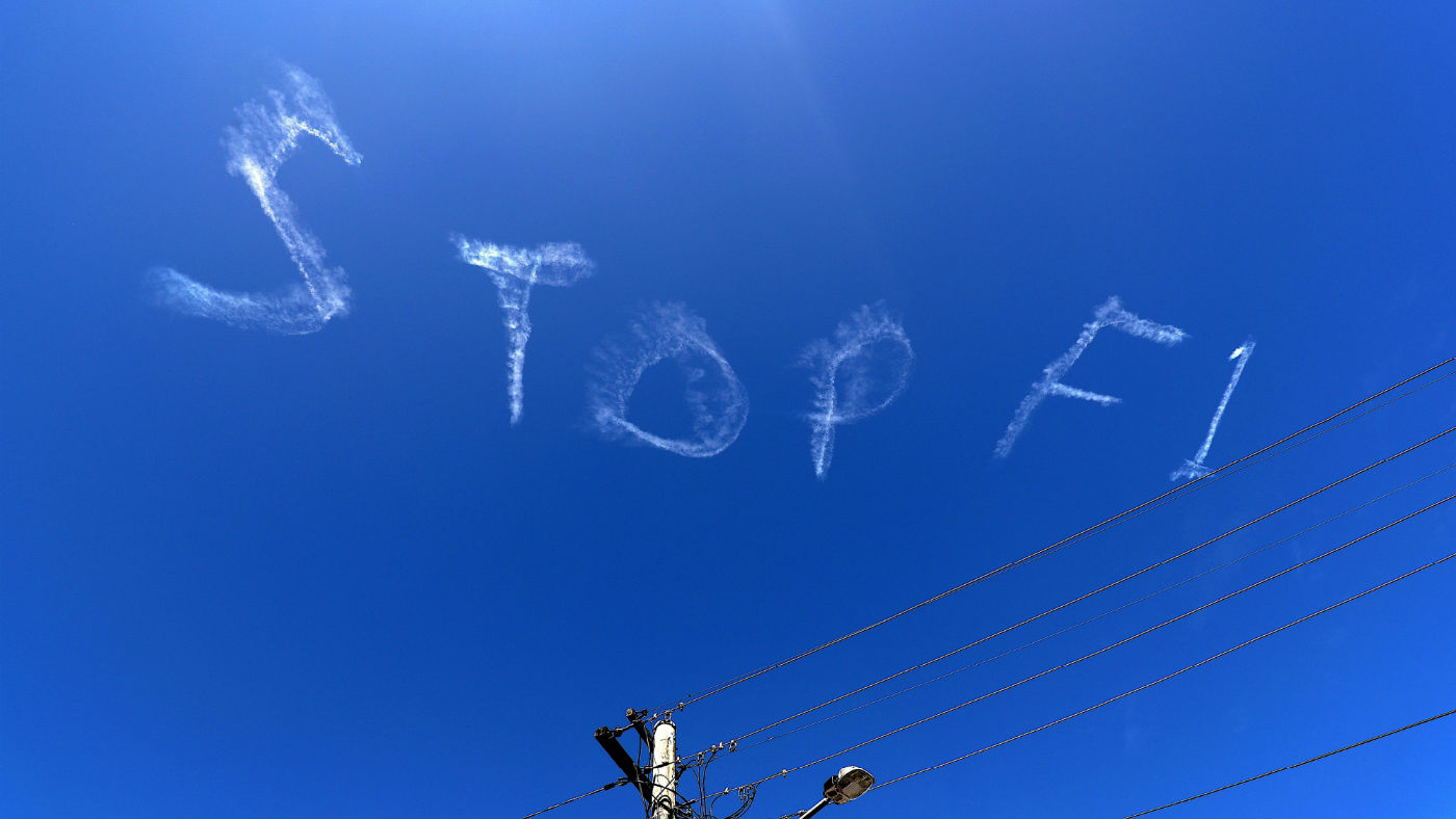 The words ‘stop F1’ are seen over the sky in Sydney, Australia on 11 March