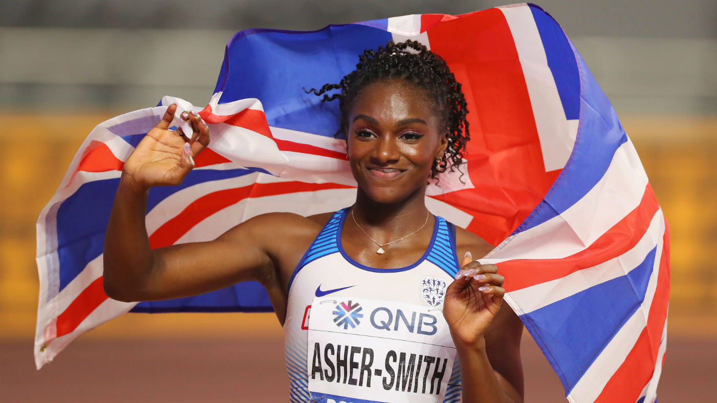 British sprinter Dina Asher-Smith celebrates her silver medal in the 100m final at the World Athletics Championships in Doha