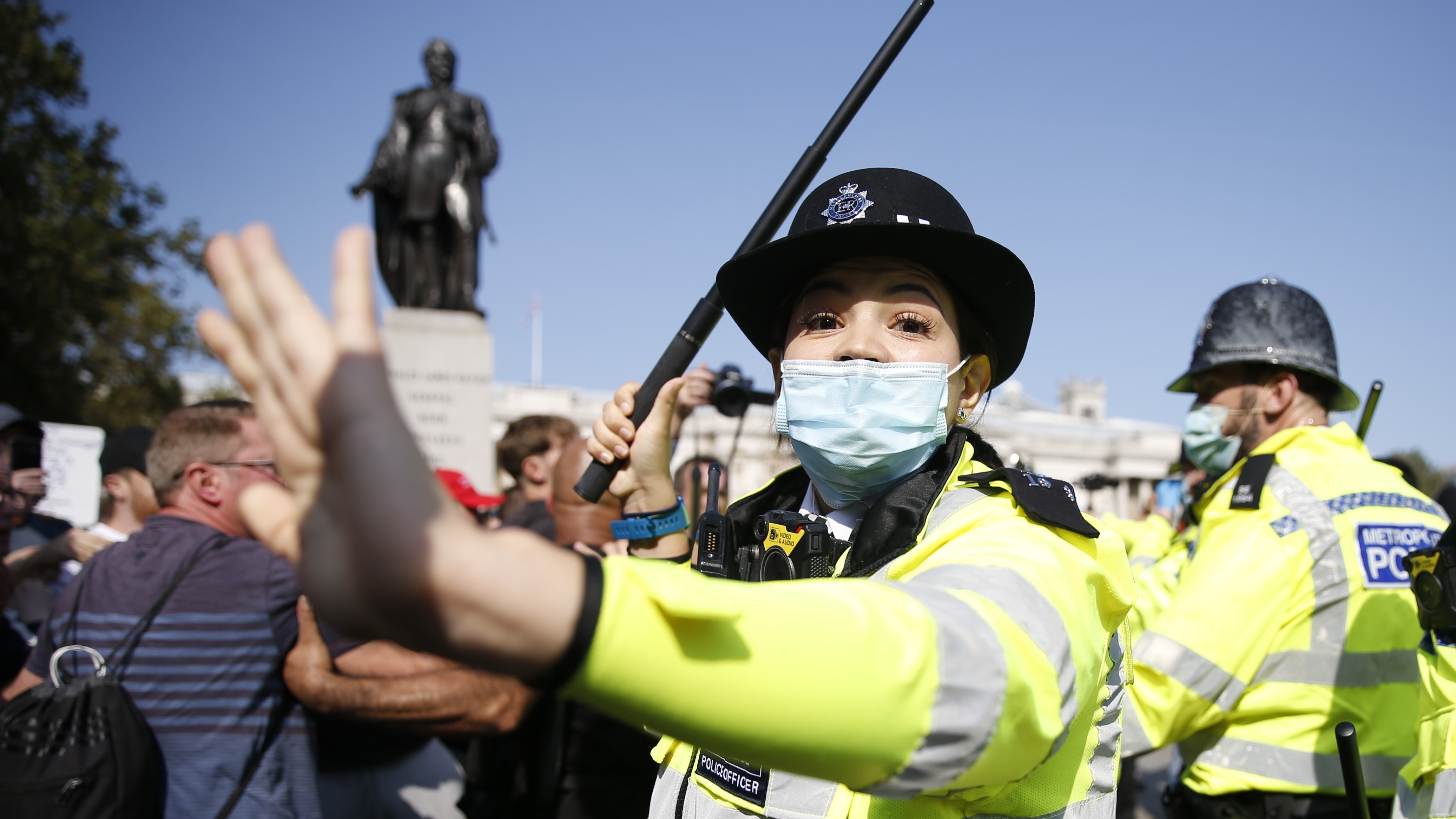 A police officer during an anti-vaccination protest in Trafalgar Square, London