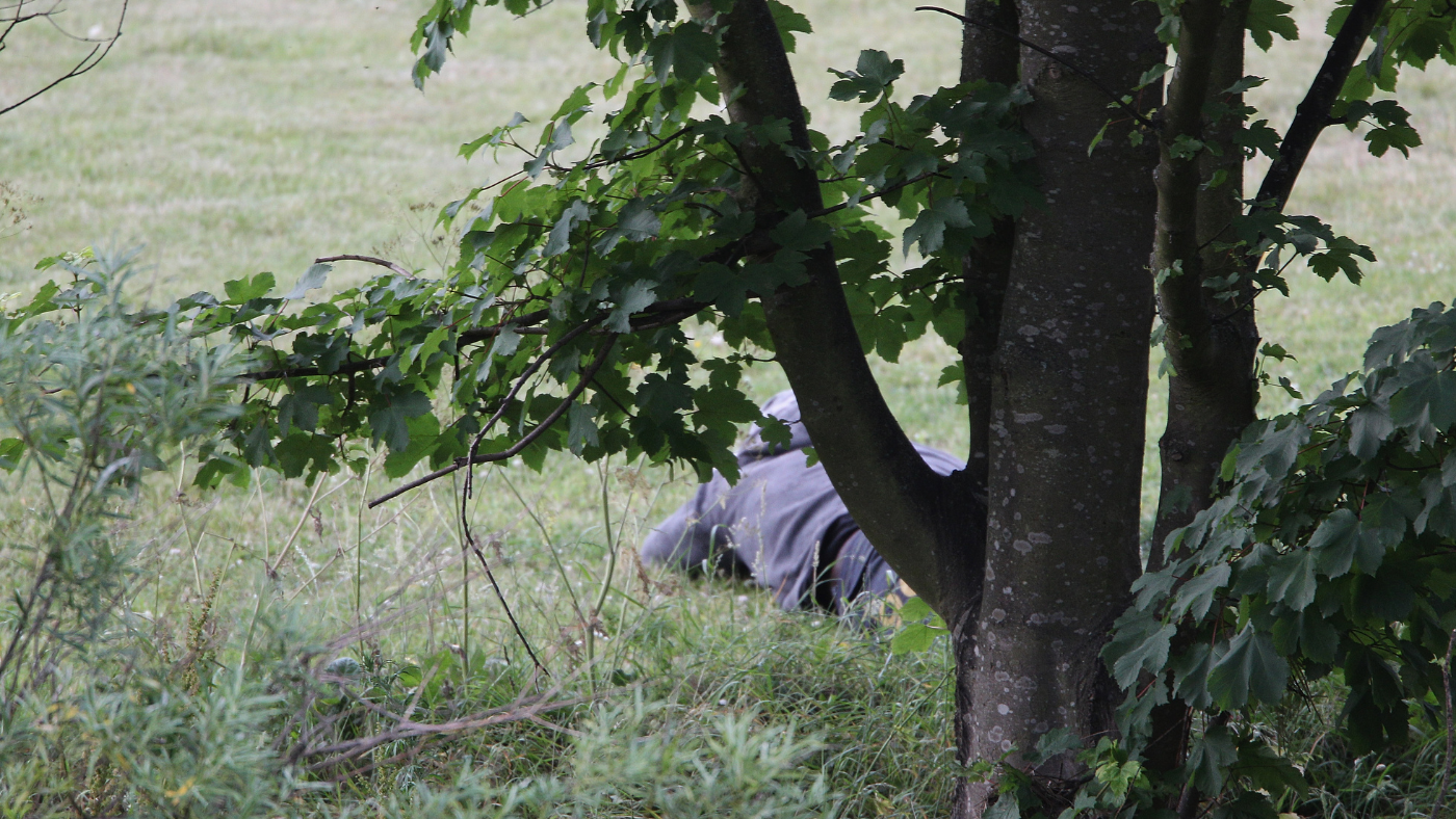 Man lying in the grass in Rothbury