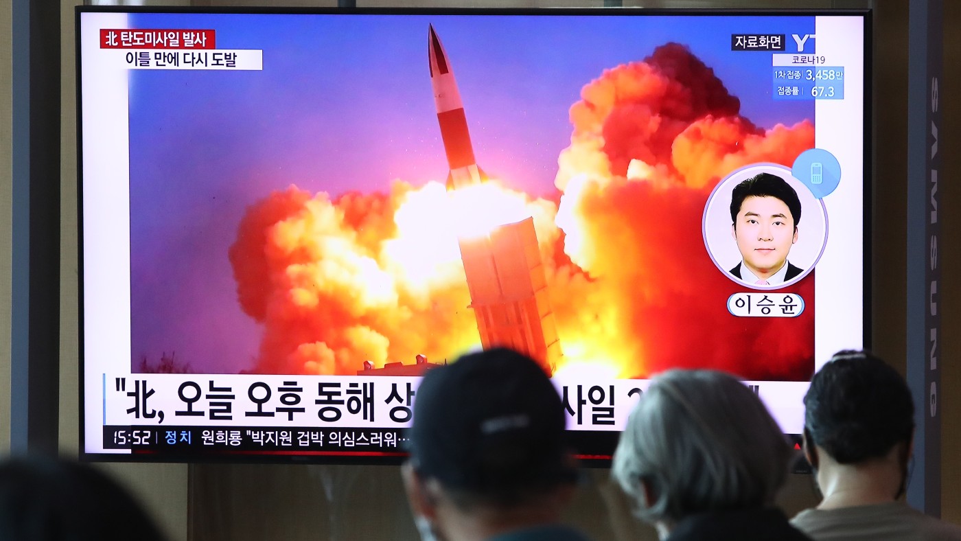 South Koreans watch the North Korean missile launch  