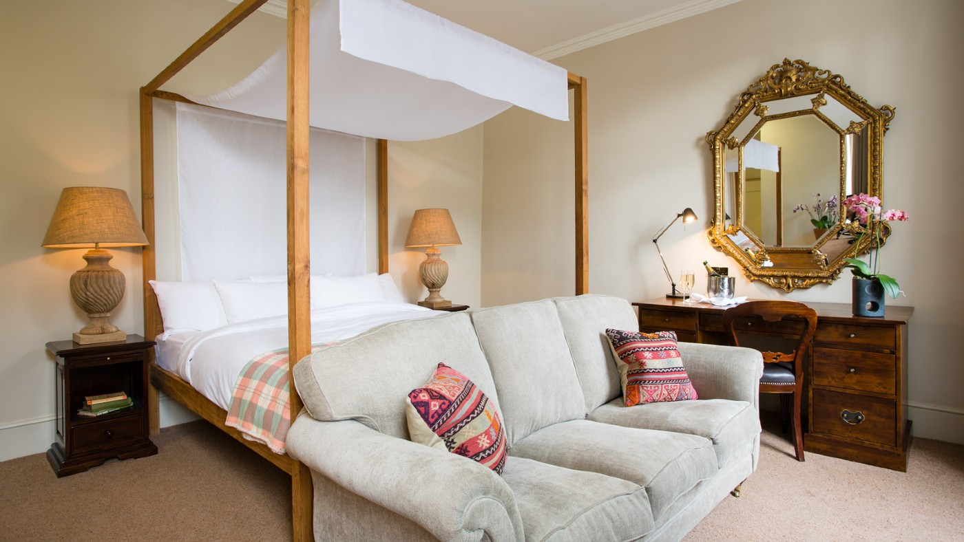 A deluxe four-poster room at The Angel Hotel, Abergavenny