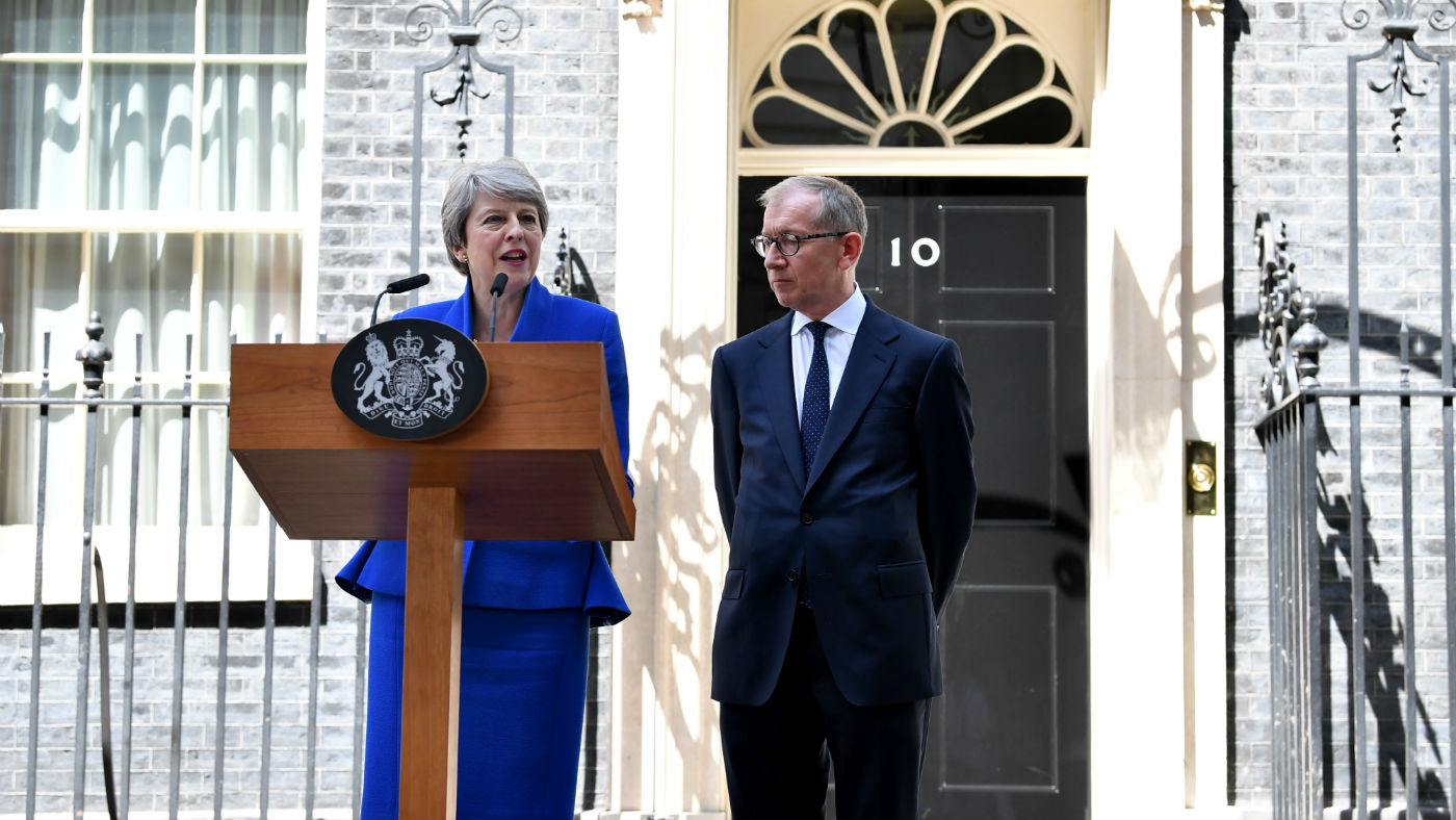 Outgoing prime minister Theresa May gives her final speech beside husband Philip May outside 10 Downing Street on 24 July 