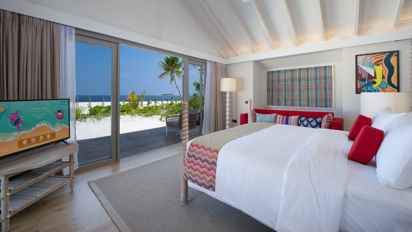 A bedroom in one of the pool suites on the beach at Cora Cora Maldives