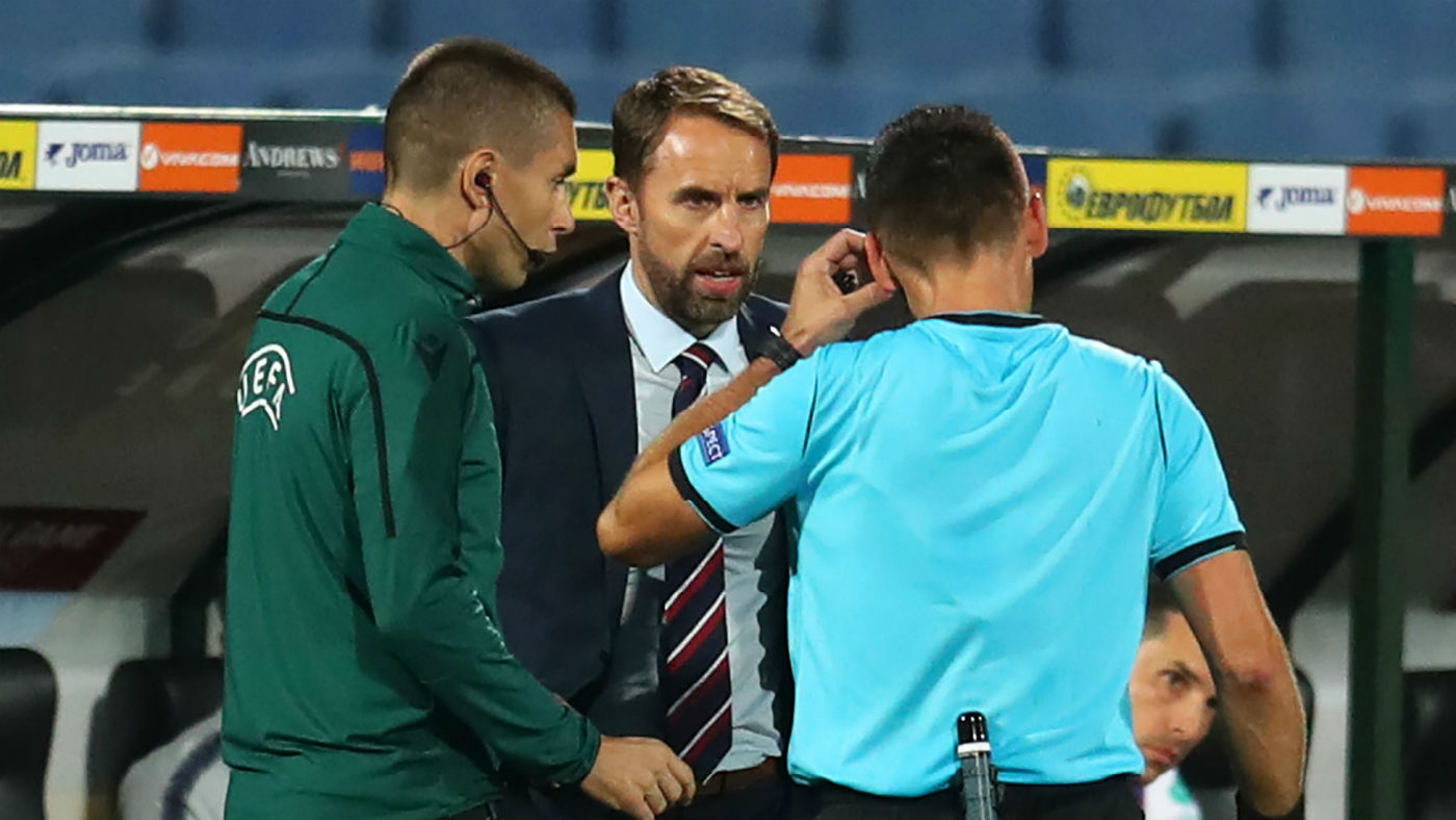 England boss Gareth Southgate speaks with the match officials during the 6-0 win against Bulgaria 
