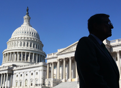 A man walks past the US Senate on Capitol Hill, Washington