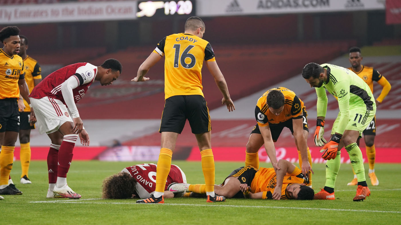 Arsenal’s David Luiz and Wolves’s Raul Jimenez lie injured after their clash of heads 