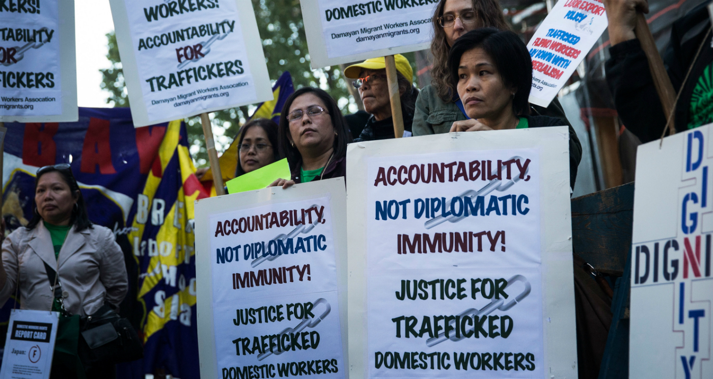 People protest against labor trafficking and modern day slavery in this file photo