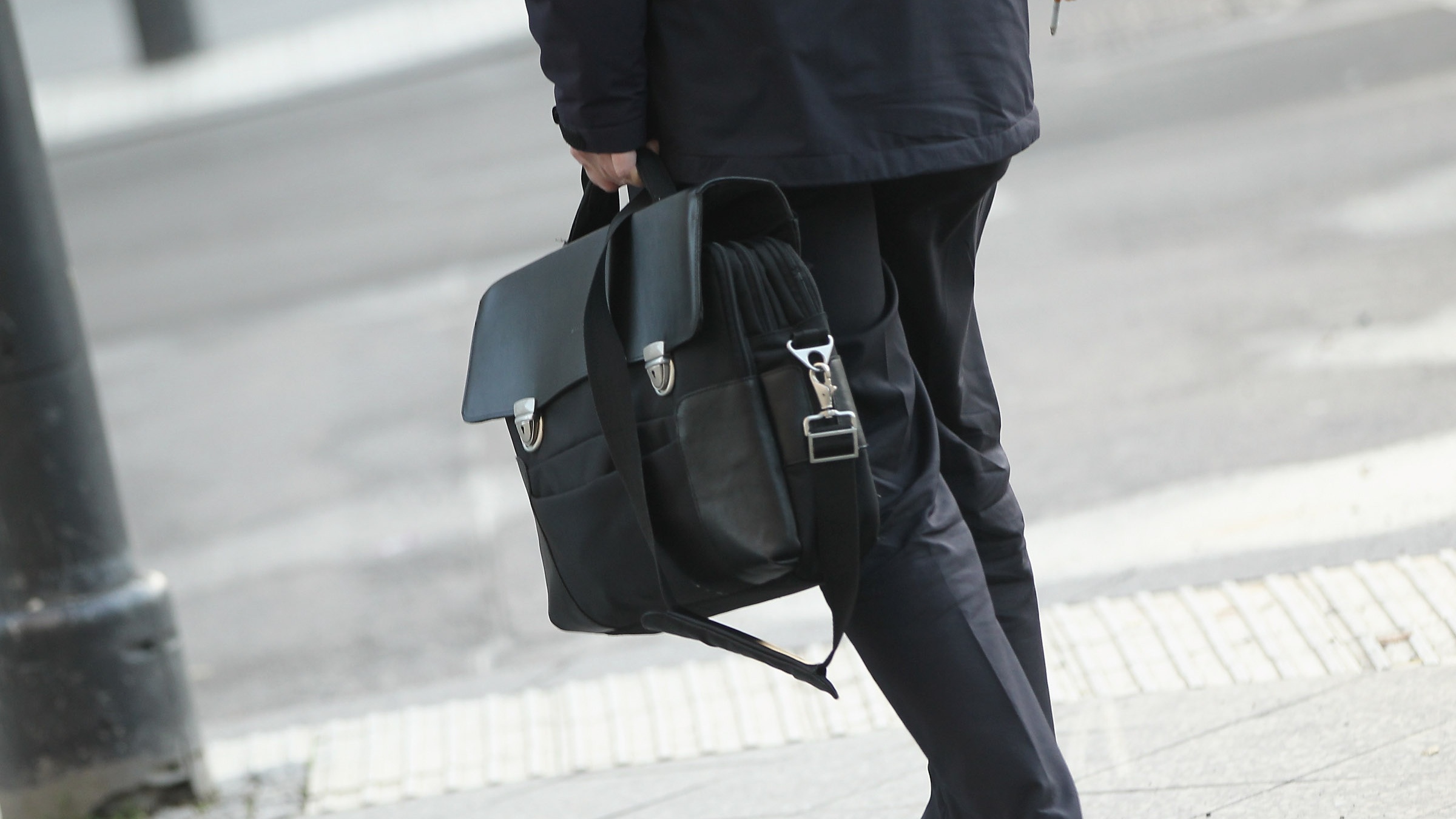 A man carrying a briefcase