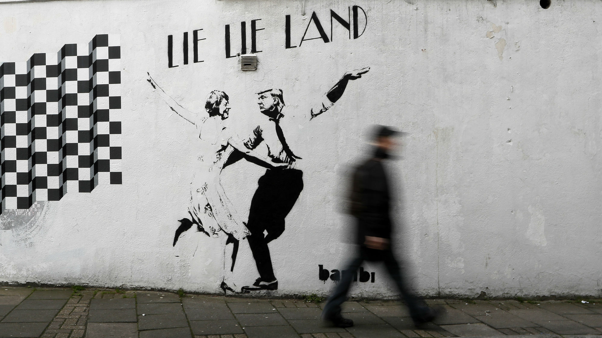 Street artist Bambi depicts and Donald Trump dancing in a La La Land-inspired mural in London