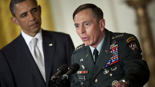 WASHINGTON - APRIL 28: President Barack Obama (L) listens while his nominee for Director of the Central Intelligence Agency (CIA), Army Gen. David Petraeus, speaks in the East Room of the Whi