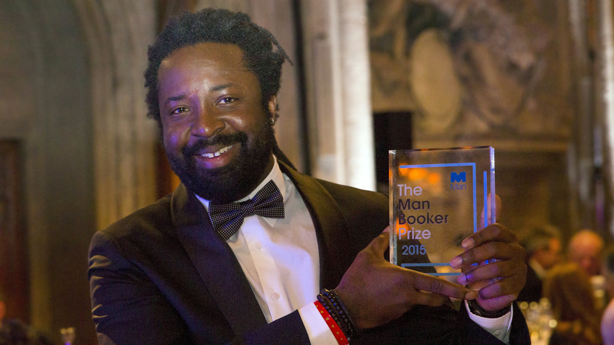 LONDON, ENGLAND - OCTOBER 13:Author Marlon James winning author of &quot;A Brief History of Seven Killings&quot;, poses with his awardat the ceremony for the Man Booker Prize for Fiction 2015 at The Gu