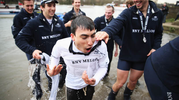 LONDON, ENGLAND - MARCH 31: Oskar Zorrilla of Oxford, the winning cox is thrown into the River Thames after the BNY Mellon 159th Oxford versus Cambridge University Boat Race on The River Tham