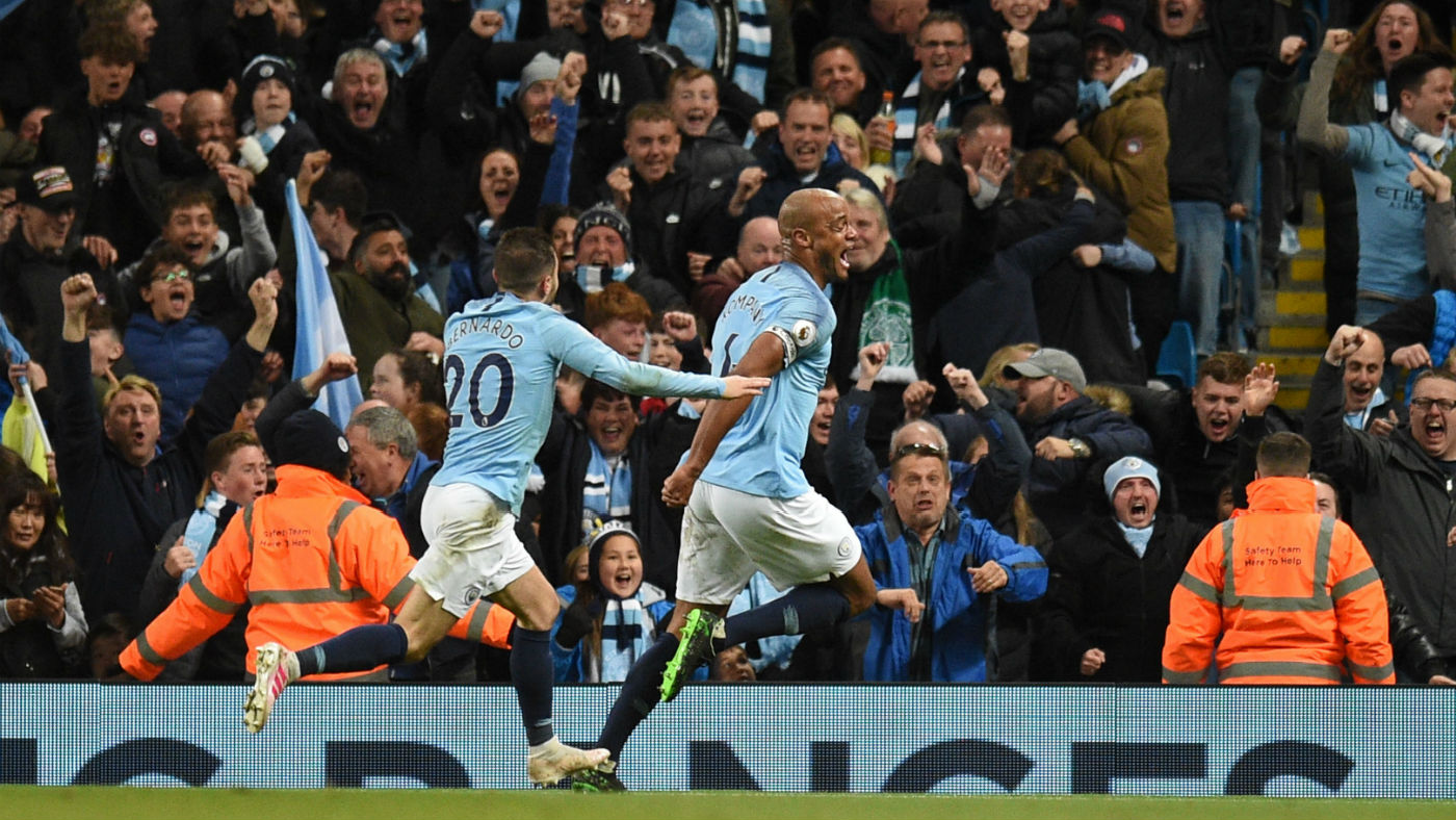 Manchester City fans celebrate Vincent Kompany’s winning goal against Leicester