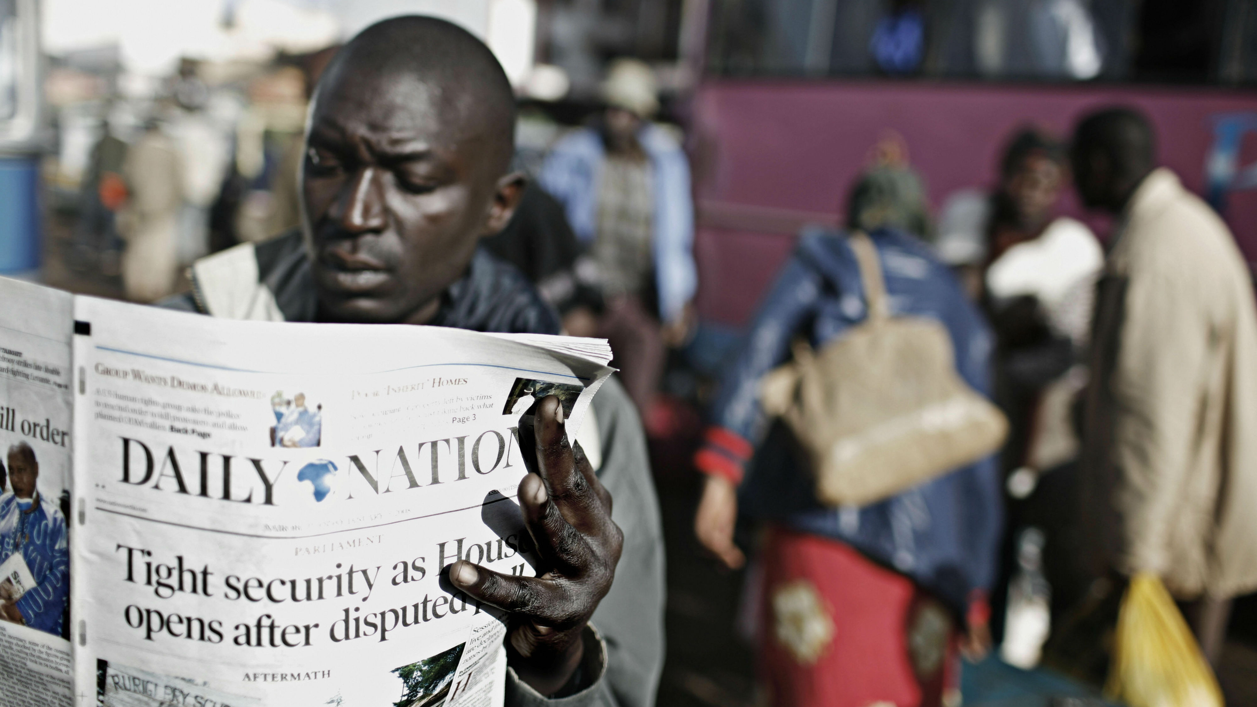 Kenyan reading newspaper