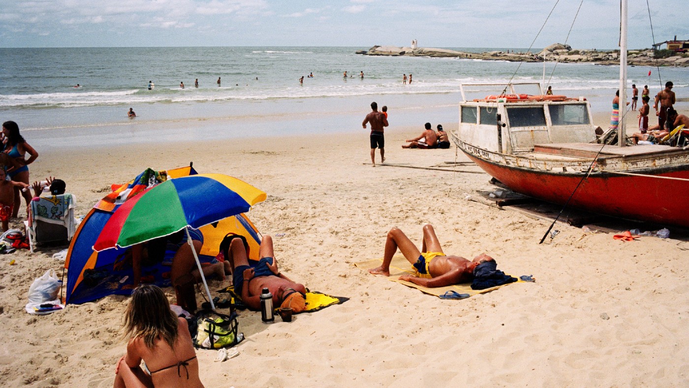 People sunbathing at the beach in Uruguay 
