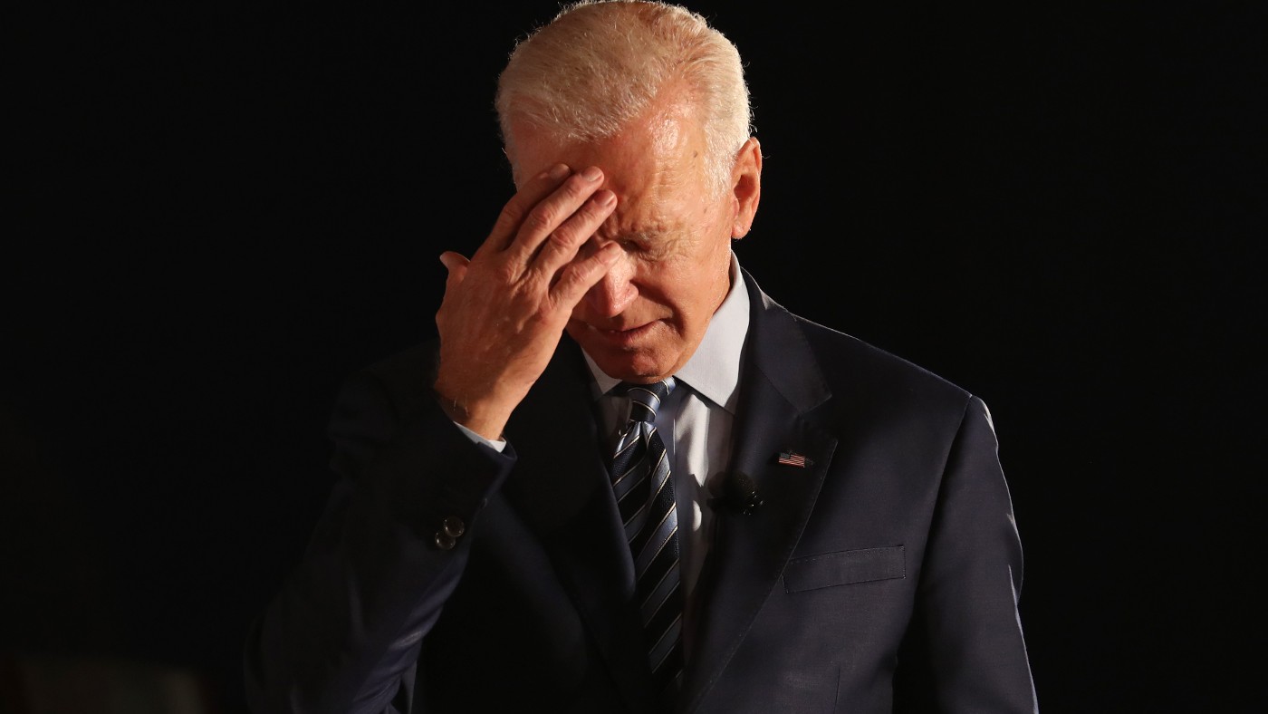 Joe Biden with his hand on his forehead