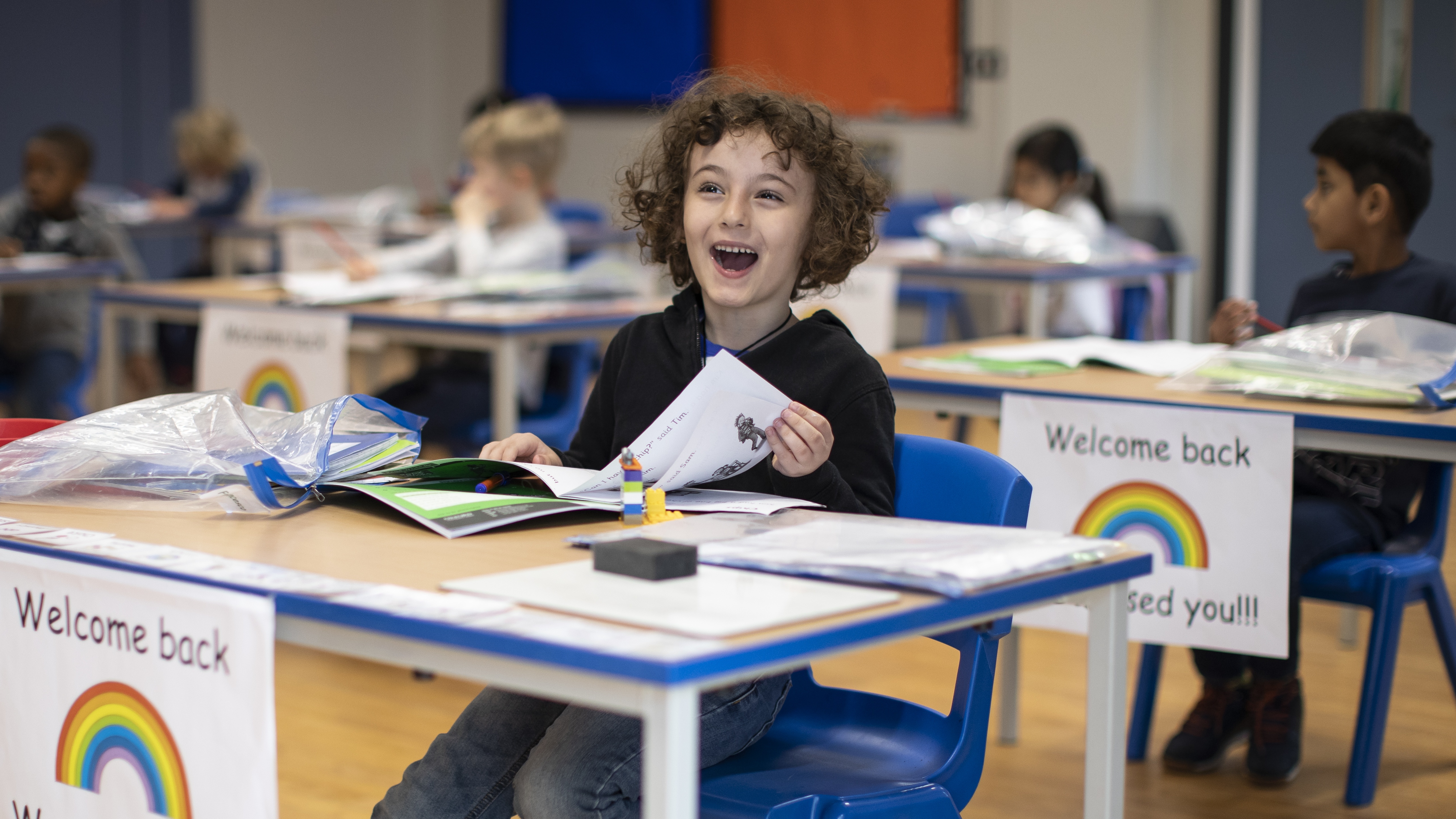 Children sit at socially distanced desks at Harris Academy, London