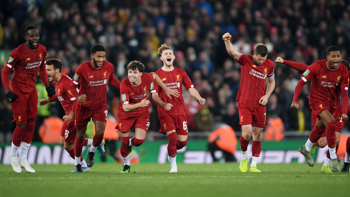Liverpool players celebrate their Carabao Cup shoot-out victory over Arsenal at Anfield 