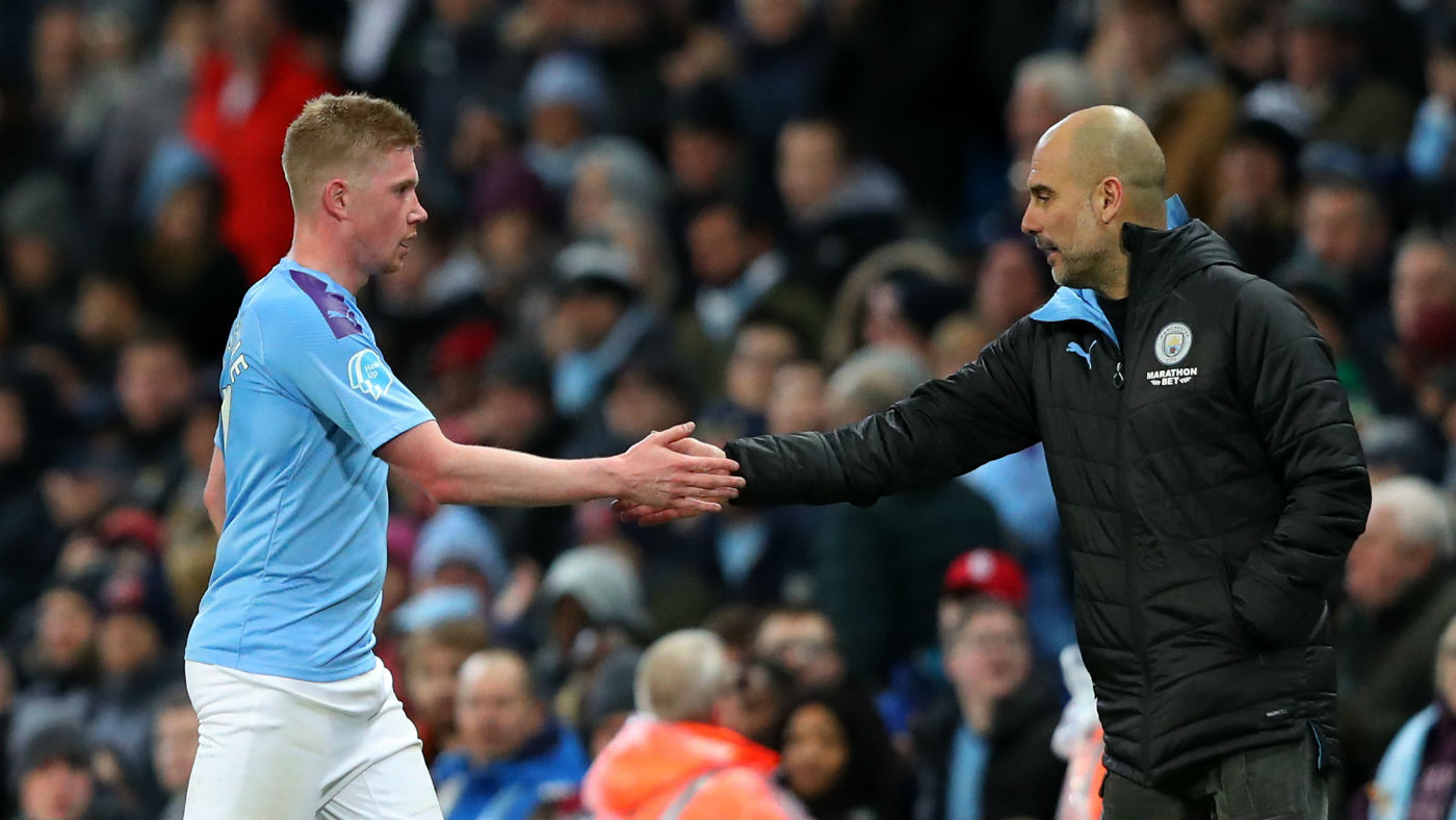 Manchester City’s Kevin De Bruyne shakes hands with head coach Pep Guardiola