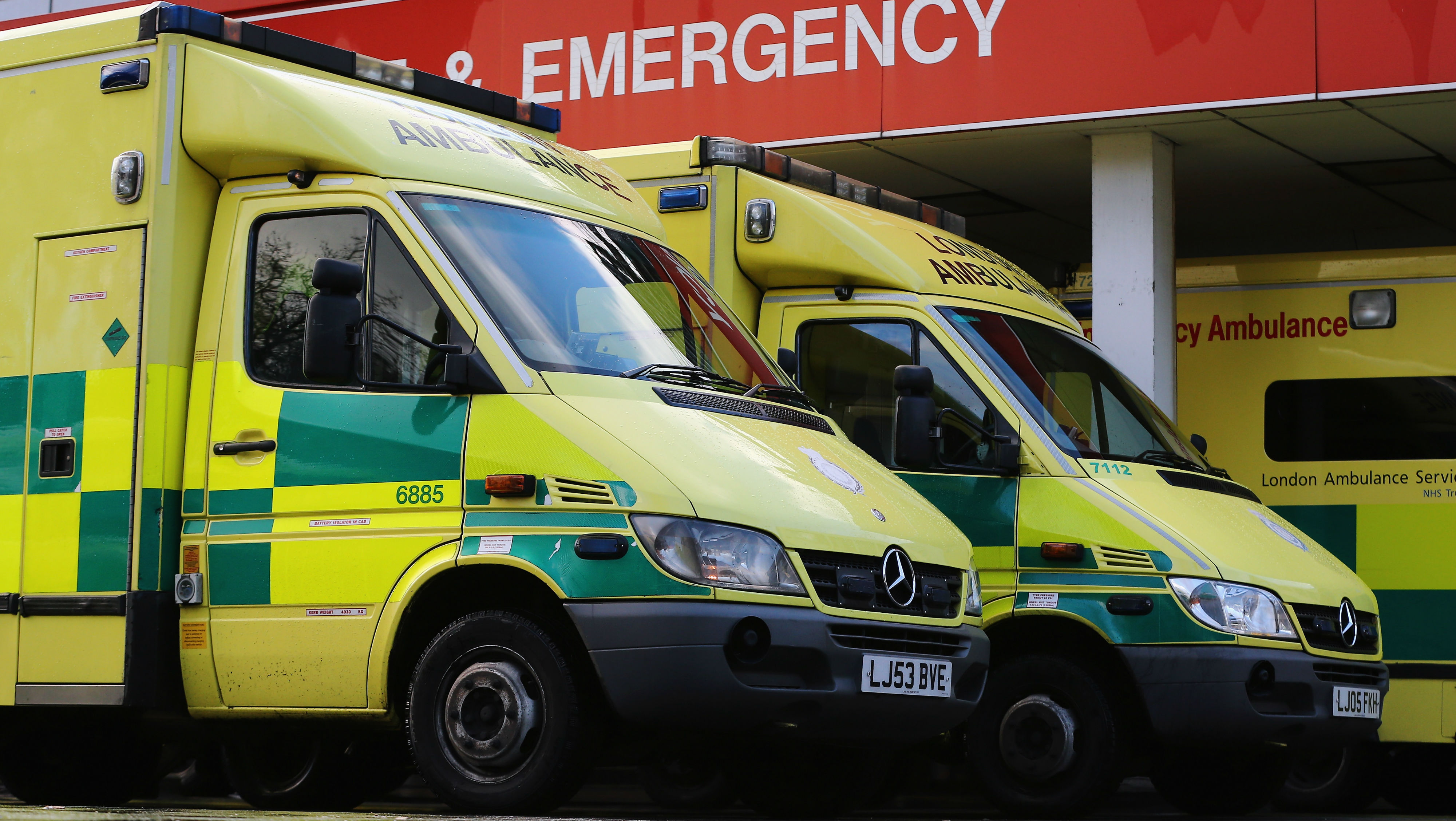 Ambulances parked outside an NHS hospital in London.