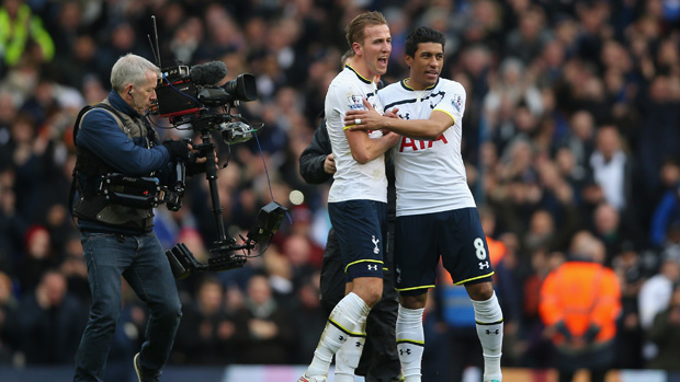 Harry Kane of and Paulino celebrate as a television camera films them