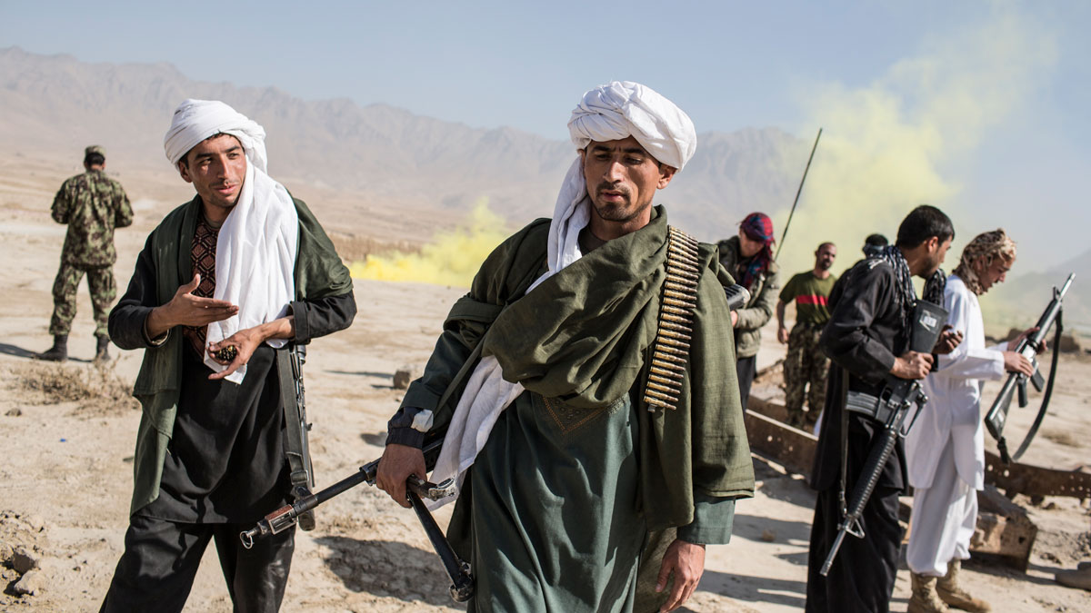 Afghan army cadets dress as Taliban fighters during an exercise