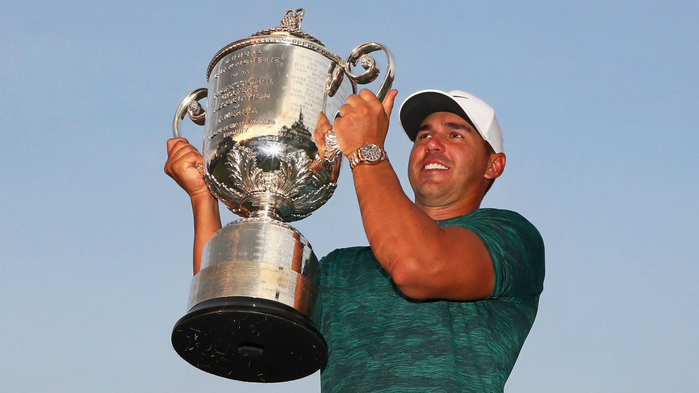 Brooks Koepka lifts the Wanamaker Trophy after his victory at the 2018 US PGA Championship