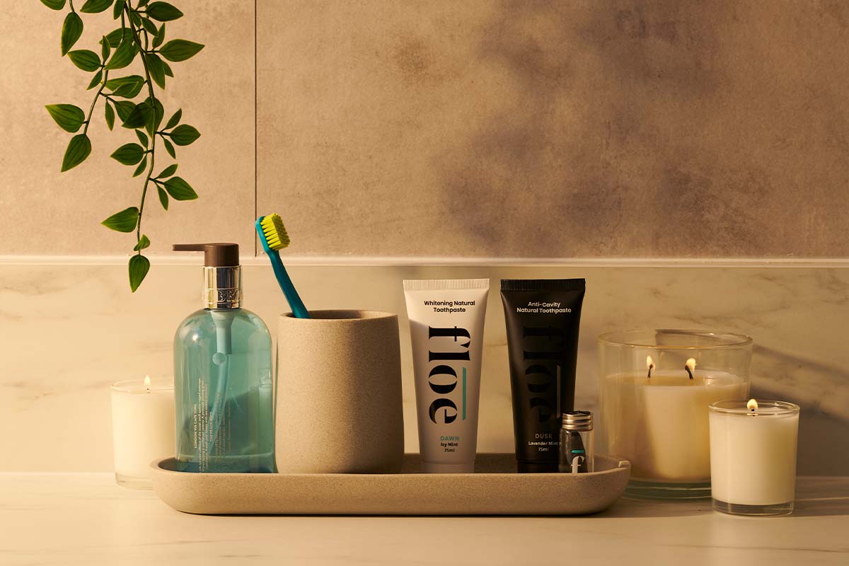Floe tooth-cleaning products on a bathroom surface