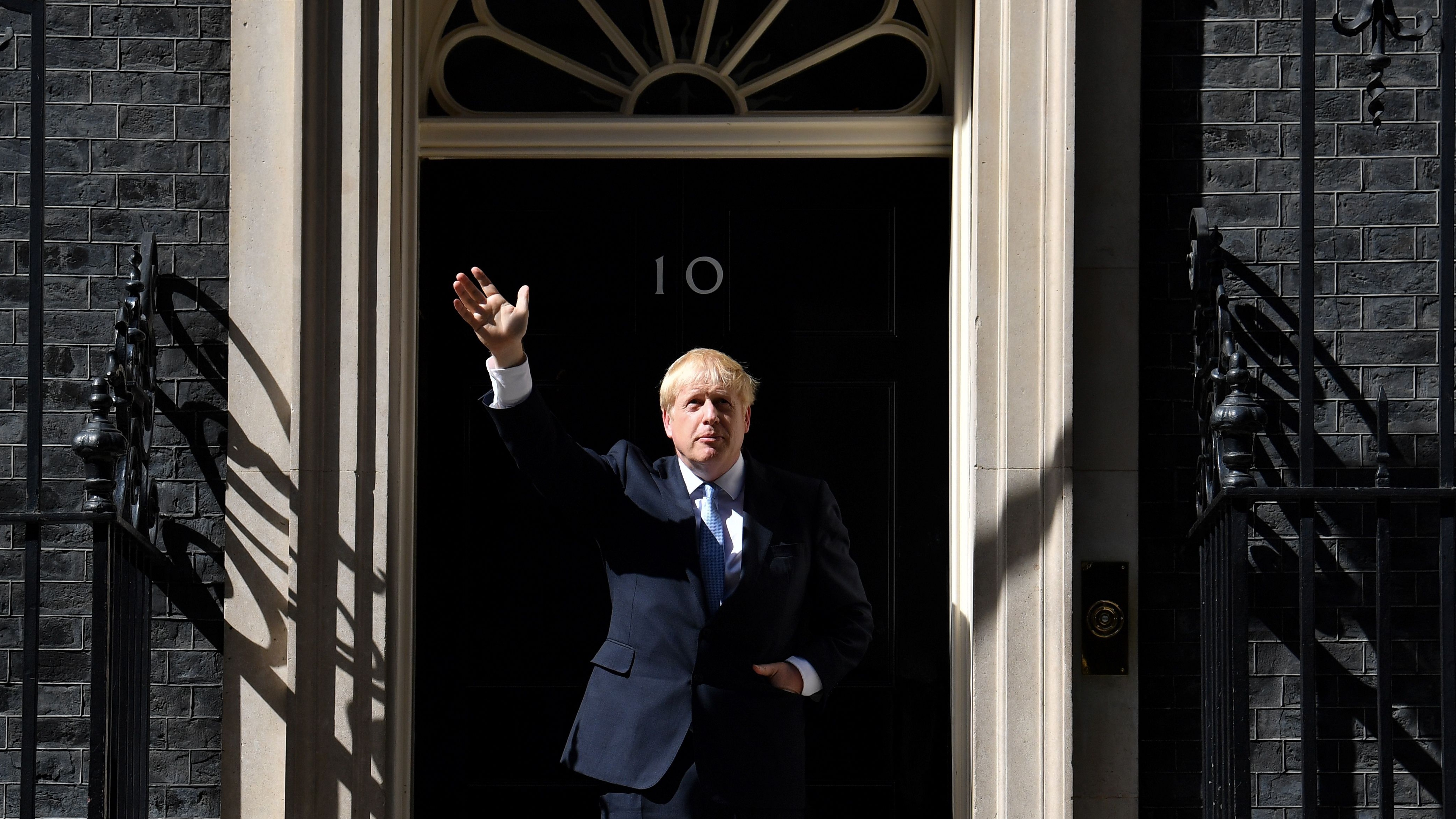 Prime Minister Boris Johnson gestures after giving a speech outside 10 Downing Street in London.