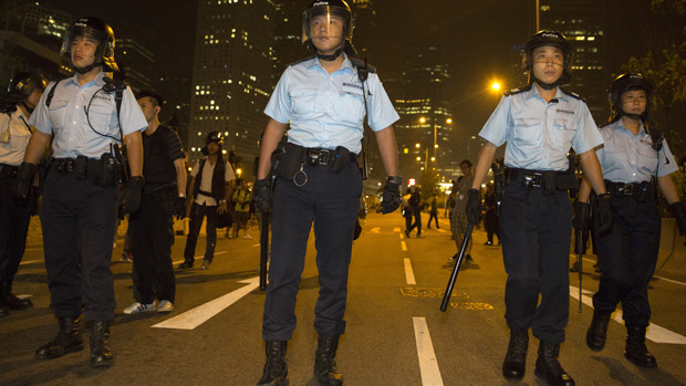 police clashing with protesters in Hong Kong