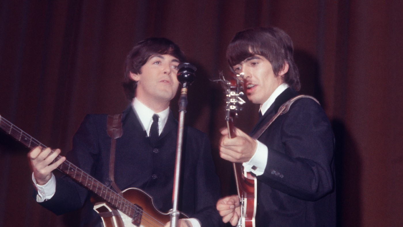 George Harrison and Paul McCartney on stage