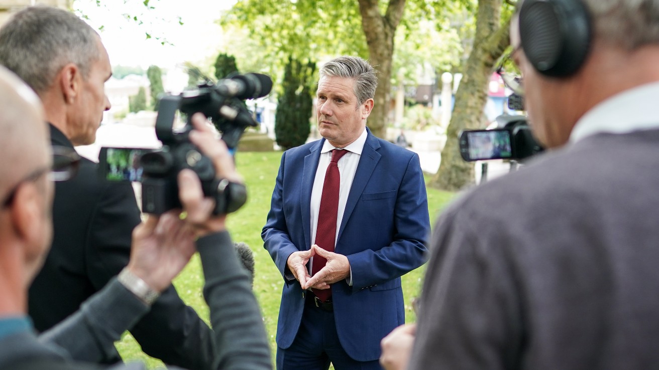 Keir Starmer speaks to reporters while campaigning in Wakefield