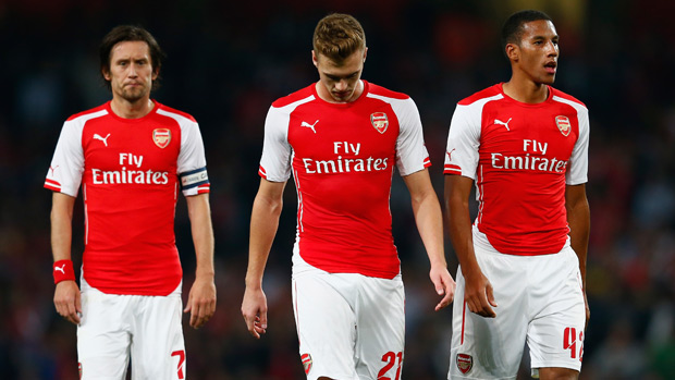 Tomas Rosicky, Calum Chambers and Isaac Hayden look dejected