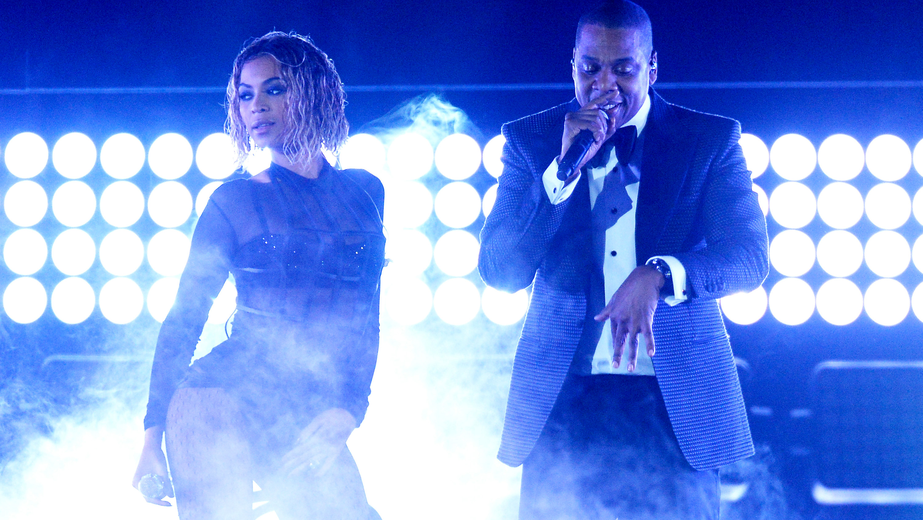 LOS ANGELES, CA - JANUARY 26:Singer Beyonce and rapper Jay Z perform onstage during the 56th GRAMMY Awards at Staples Center on January 26, 2014 in Los Angeles, California.(Photo by Kevork Dj