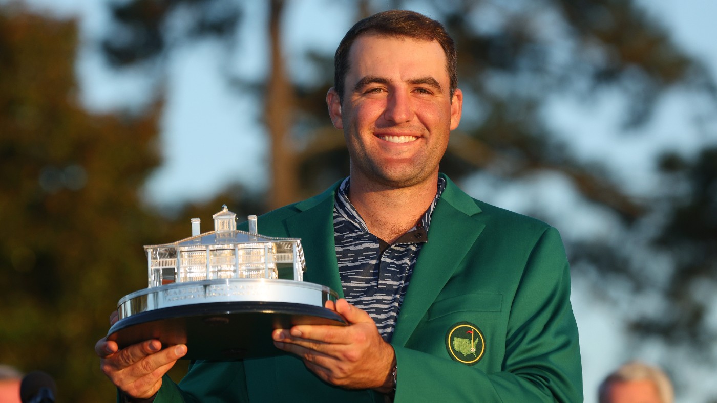 American golfer Scottie Scheffler poses with the Masters trophy and Green Jacket