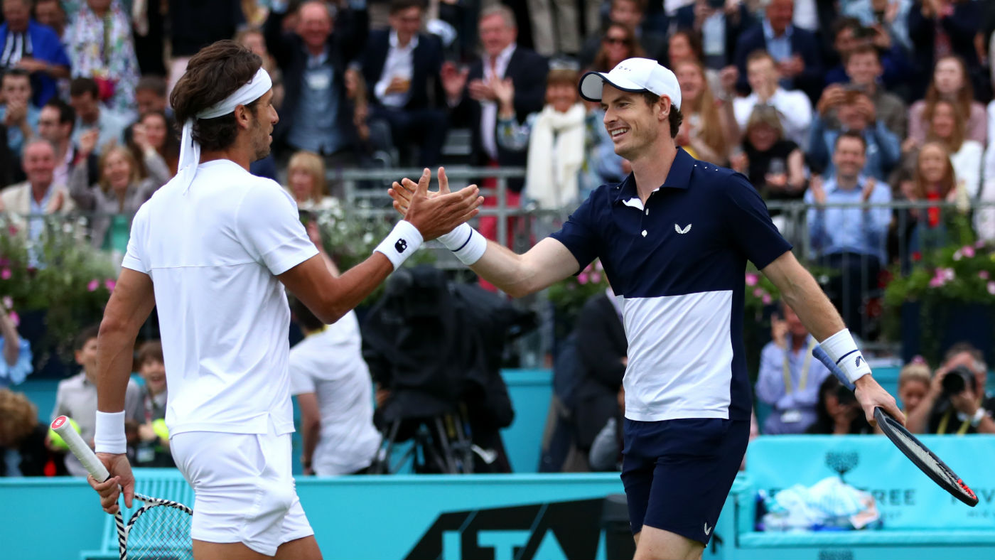 Feliciano Lopez and Andy Murray celebrate their doubles win at Queen’s