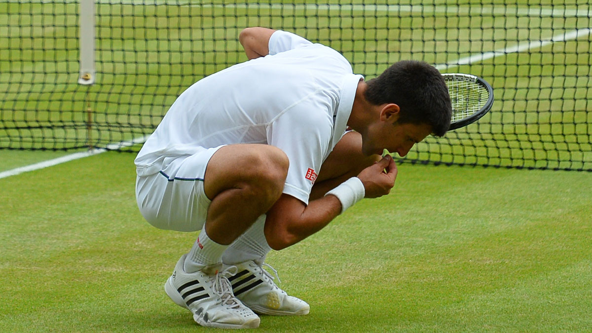 Novak Djokovic eats grass after winning Wimbledon 2015